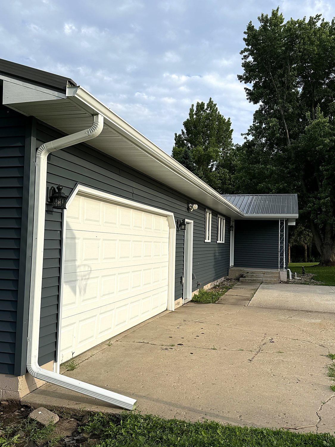Gutter run and downspouts across a garage and breezeway