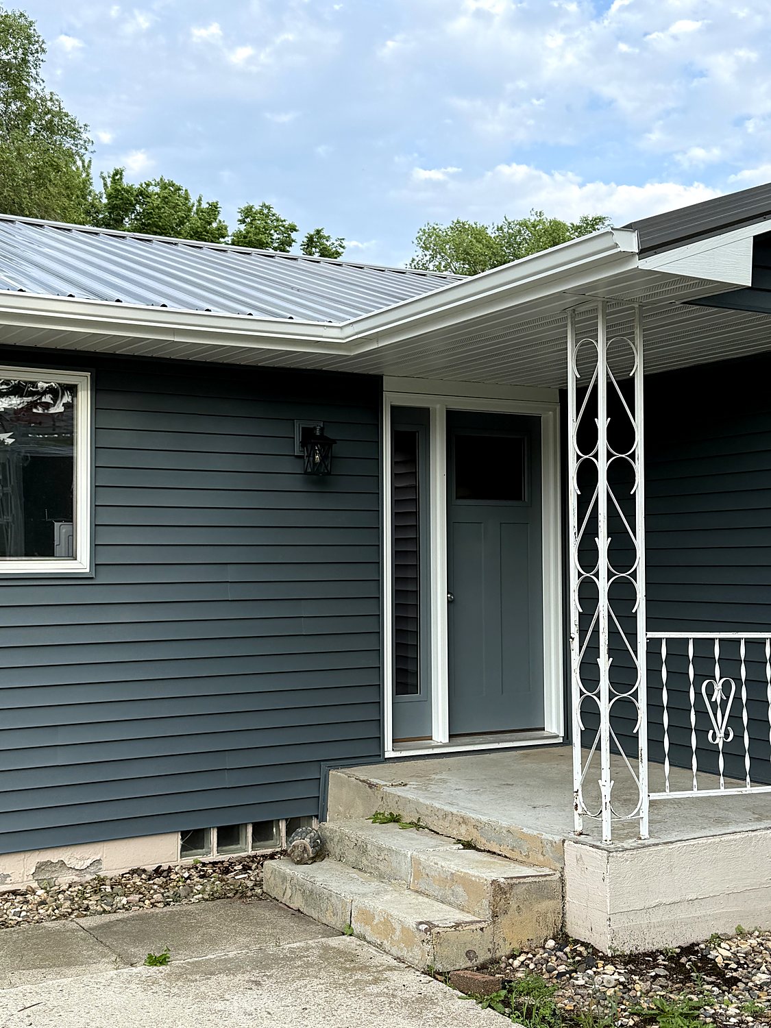 Gutter and downspout at a front entry